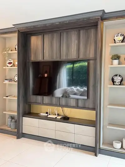 Luxurious living room with elegant built-in entertainment center and stylish decor.