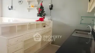 Cozy kitchen with holiday decor and ample storage space