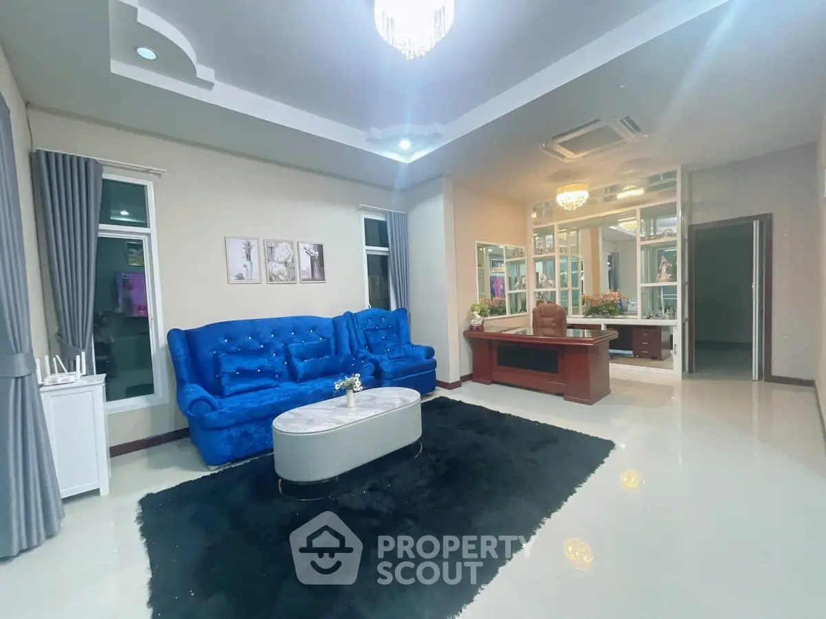 Luxurious living room with plush blue sofa and elegant decor