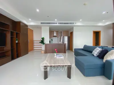 Spacious modern living room with open kitchen and stylish furniture