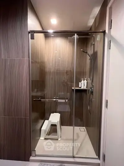 Modern bathroom with glass shower enclosure and sleek design