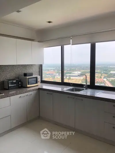 Modern kitchen with stunning panoramic view and sleek appliances