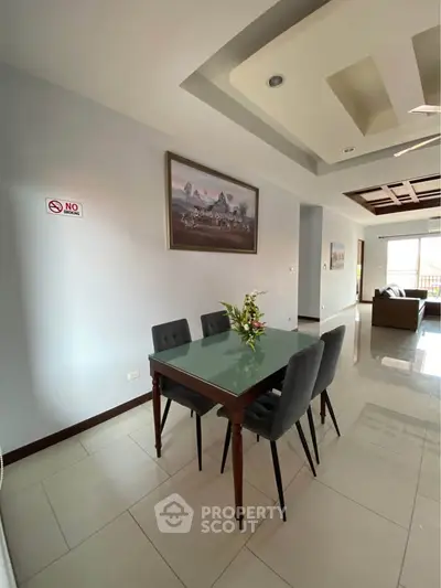 Spacious dining area with elegant decor and natural light in modern apartment