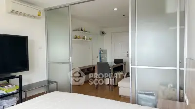 Modern studio apartment with sliding glass doors and cozy dining area