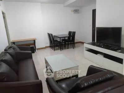 Spacious living room with modern furniture and sleek TV setup