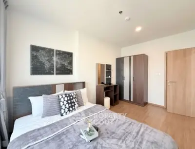 Modern bedroom with stylish decor and ample natural light