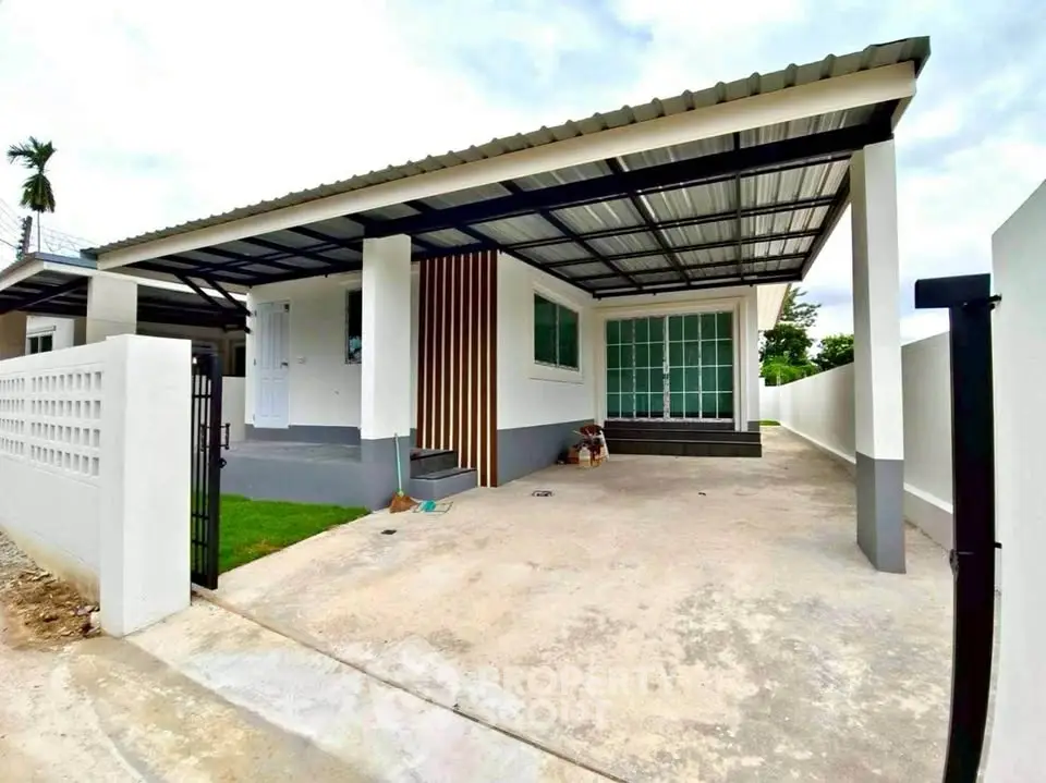 Modern single-story home with covered carport and spacious driveway