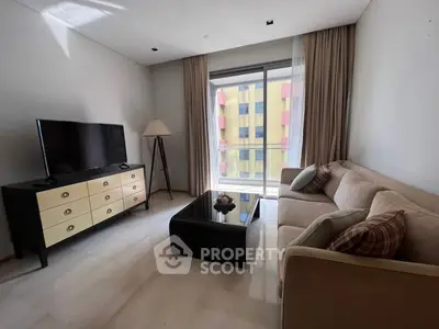 Modern living room with sleek furniture and large window view