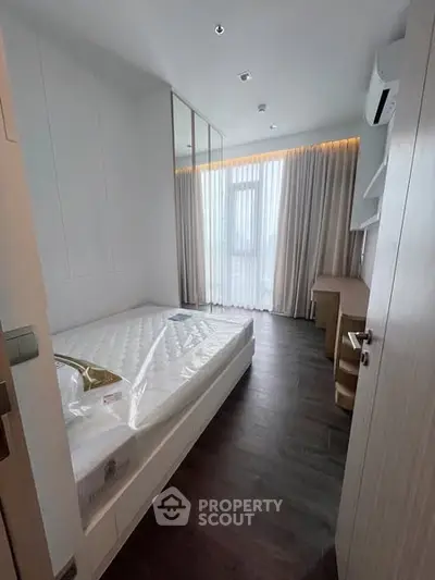 Modern bedroom with sleek design and natural light