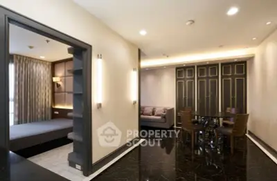 Luxurious modern apartment interior with elegant dining area and cozy bedroom.