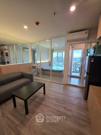 Modern living room with city view and sleek furnishings