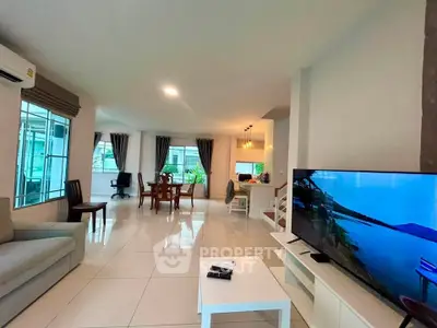 Spacious modern living room with open layout and large windows