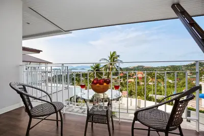 Stunning balcony with panoramic views and elegant outdoor seating, perfect for relaxation.