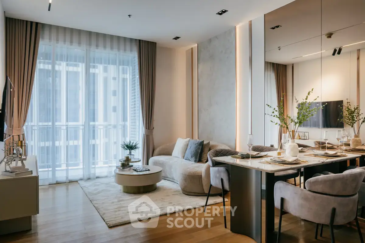 Luxurious modern living room with elegant decor and large windows in a high-rise apartment.