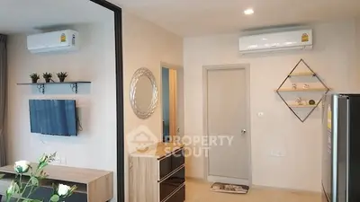 Modern living room with air conditioning and stylish decor in a contemporary apartment.