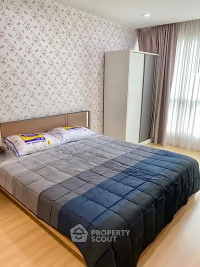 Cozy bedroom with modern decor and ample natural light