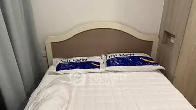 Cozy bedroom with double bed and stylish headboard, perfect for restful nights.
