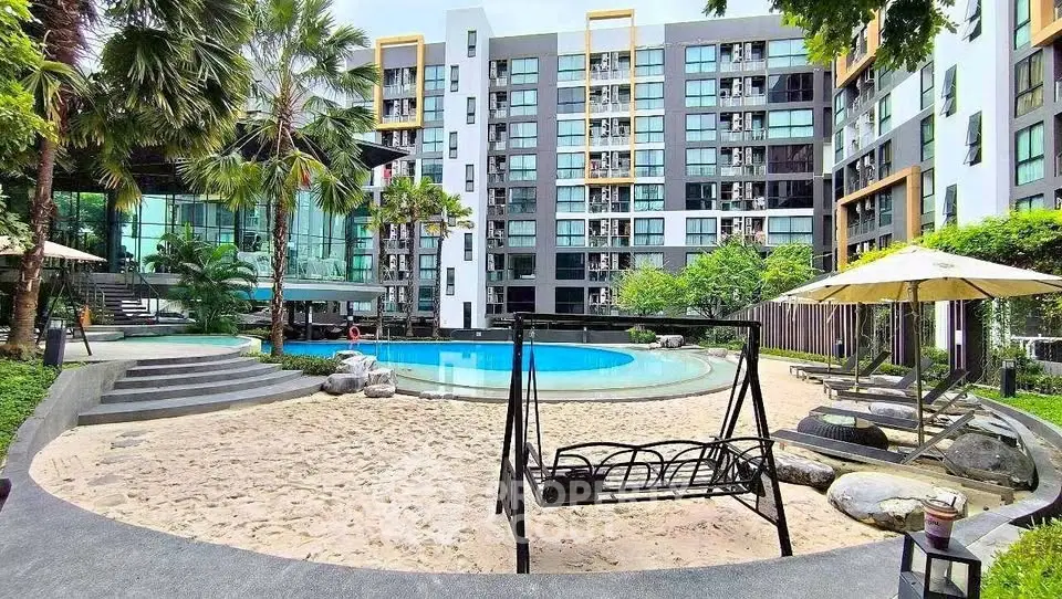 Luxurious apartment complex with pool and lush garden view