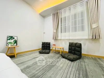 Minimalist living room with floor seating and modern decor