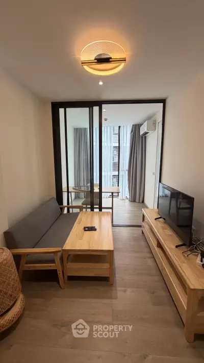 Modern living room with stylish furniture and natural light in a contemporary apartment.