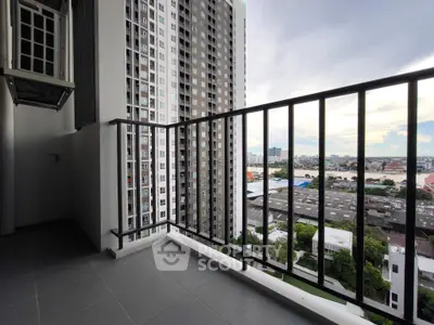 Spacious balcony with stunning city view in modern high-rise apartment