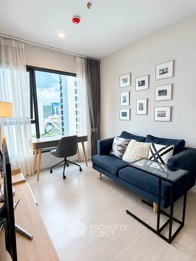 Modern living room with city view, stylish decor, and natural light.