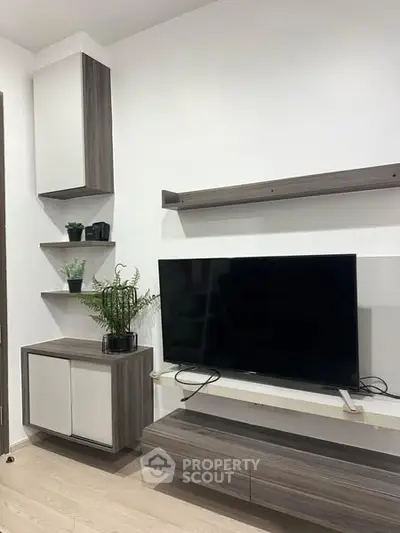 Modern living room with sleek TV unit and minimalist decor