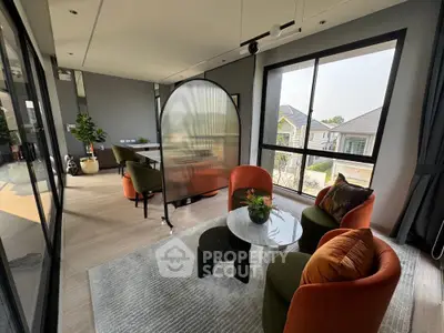 Stylish modern living room with large windows and elegant furniture