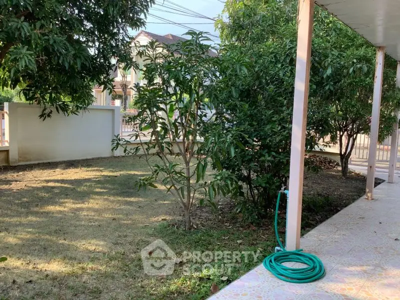 Charming garden view with lush greenery and spacious outdoor area, perfect for relaxation and leisure.
