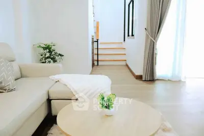 Bright and modern living room with cozy sofa and stylish decor