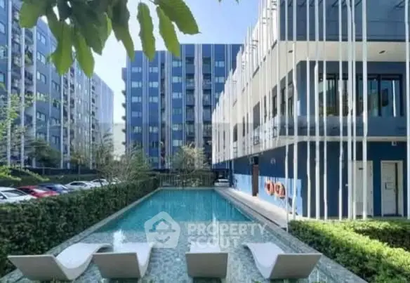 Modern apartment complex with sleek pool and stylish architecture