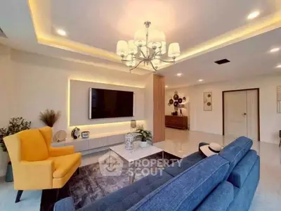 Spacious modern living room with elegant chandelier and stylish decor