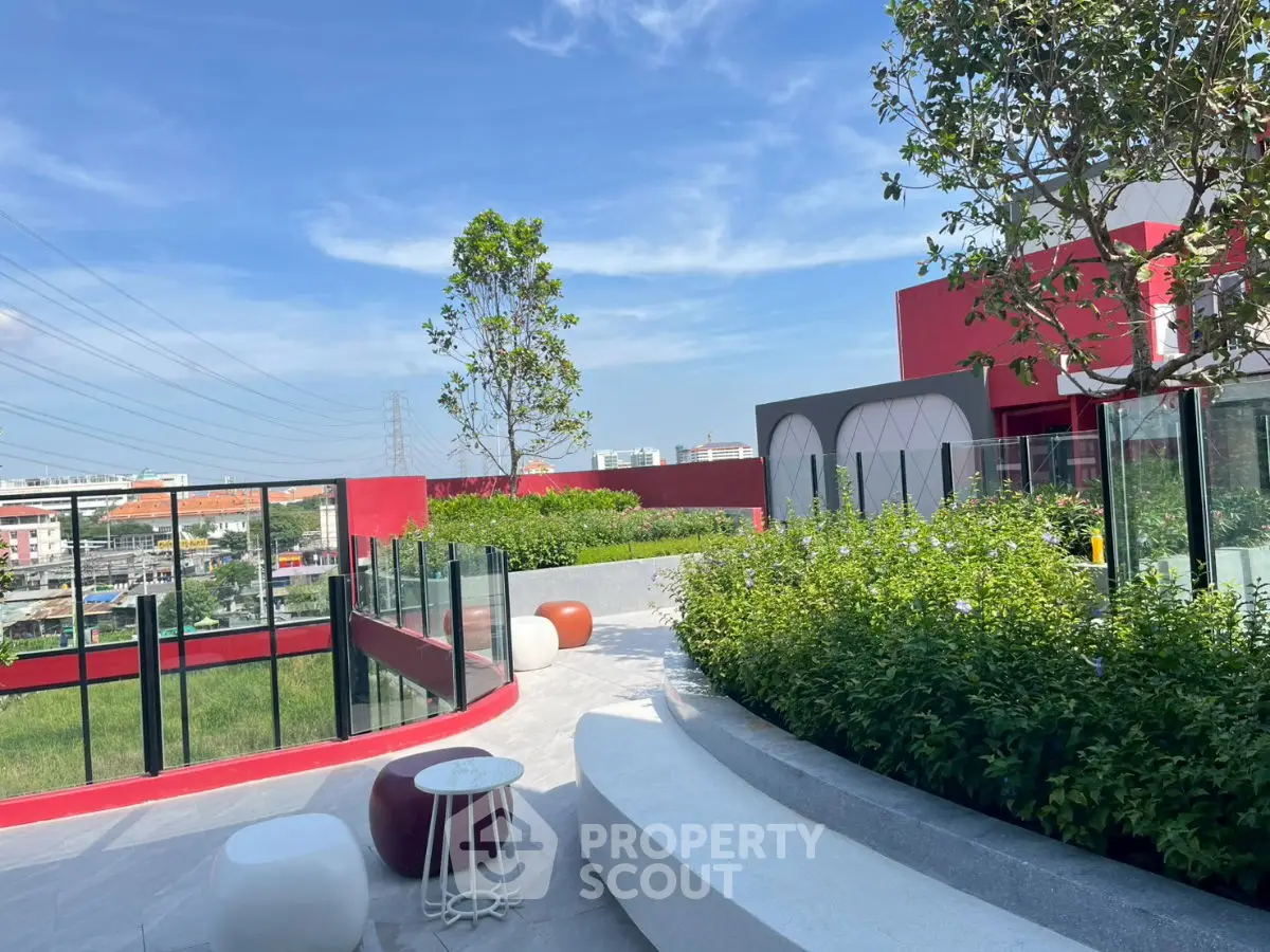 Stunning rooftop garden with modern seating and panoramic city views, perfect for relaxation and entertainment.