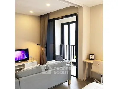 Modern living room with balcony access and stylish furniture