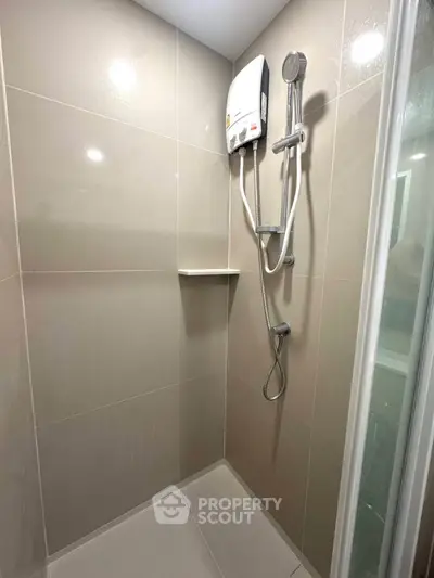 Modern bathroom shower with sleek tiles and water heater