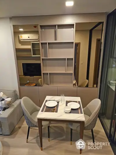 Modern dining area with elegant table and chairs in stylish apartment