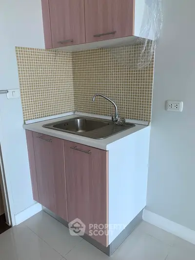 Modern compact kitchen with stylish cabinetry and sleek sink design