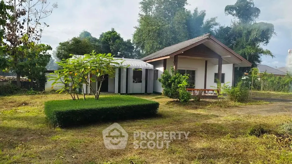 Charming single-story house with lush garden and spacious yard, perfect for serene living.