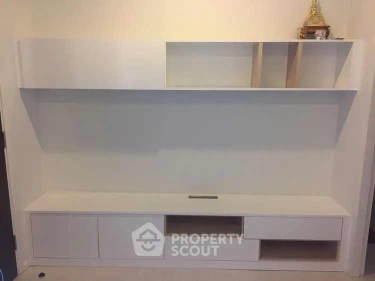 Modern minimalist white storage unit with open shelves and cabinets