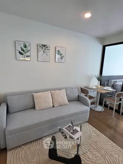 Stylish living room with modern decor and cozy dining area, perfect for urban living.
