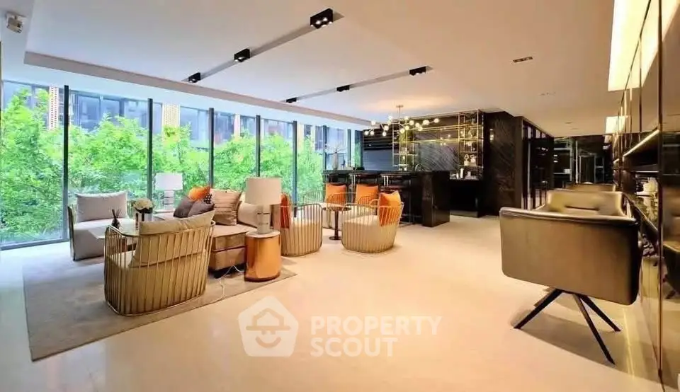 Luxurious modern living room with floor-to-ceiling windows and stylish furniture.