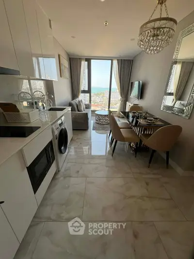 Stylish open-plan living room with modern kitchen and city view