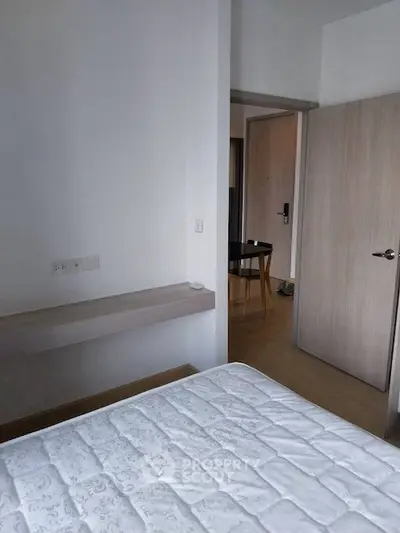 Modern bedroom with minimalist design and wooden flooring