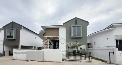 Modern suburban house with unique architectural design and spacious driveway.