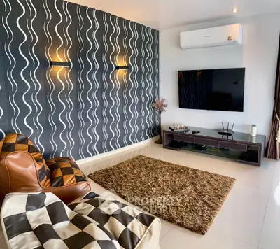 Stylish modern living room with unique wall design and cozy seating area.