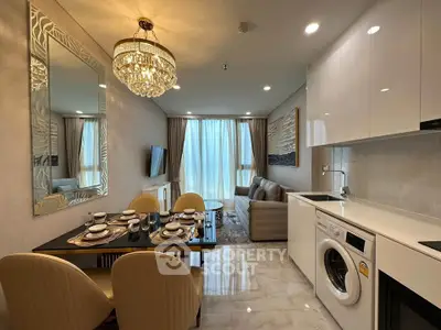 Luxurious open-plan living room with elegant dining area and modern kitchen appliances.