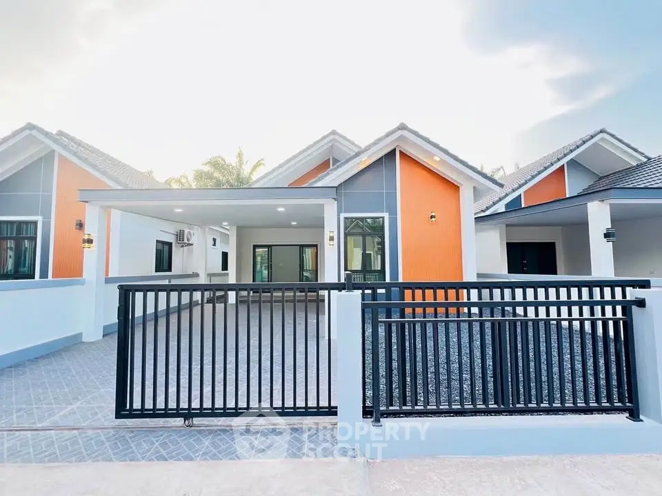 Modern single-story house with spacious driveway and stylish facade