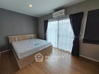 Spacious bedroom with natural light and modern design