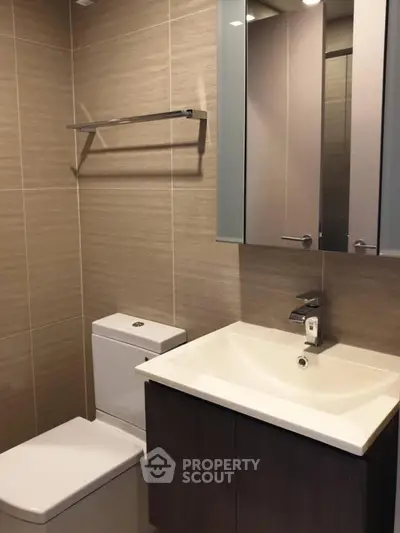Modern bathroom with sleek fixtures and ample storage space