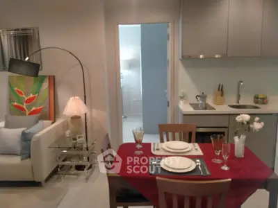 Modern open-plan living room and kitchen with stylish decor and dining setup.